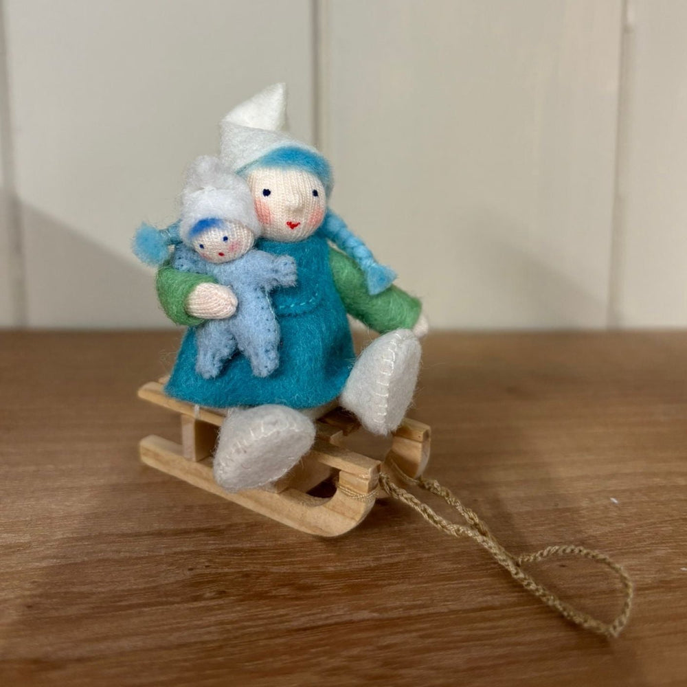 Ambrosius Winter Gnome Girl on Sleigh with Doll