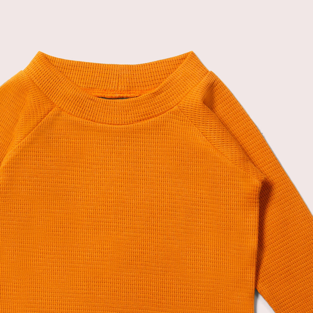 
                      
                        Little Green Radicals Golden Ochre Waffle Long Sleeve Cosy Top
                      
                    