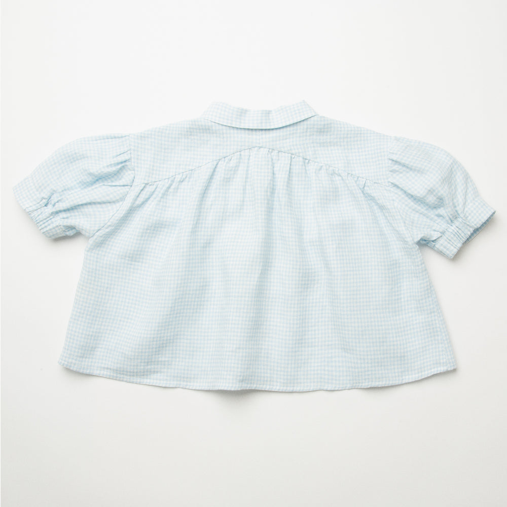 
                      
                        Nellie Quats Duck Duck Goose Blouse - Baby Blue & Milk Mini Check Linen
                      
                    